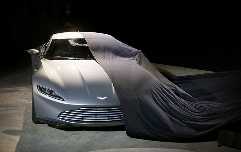 An Aston Martin DB10 car is unveiled on stage during an event to mark the start of production for the new James Bond film titled 'Spectre'. Reuters