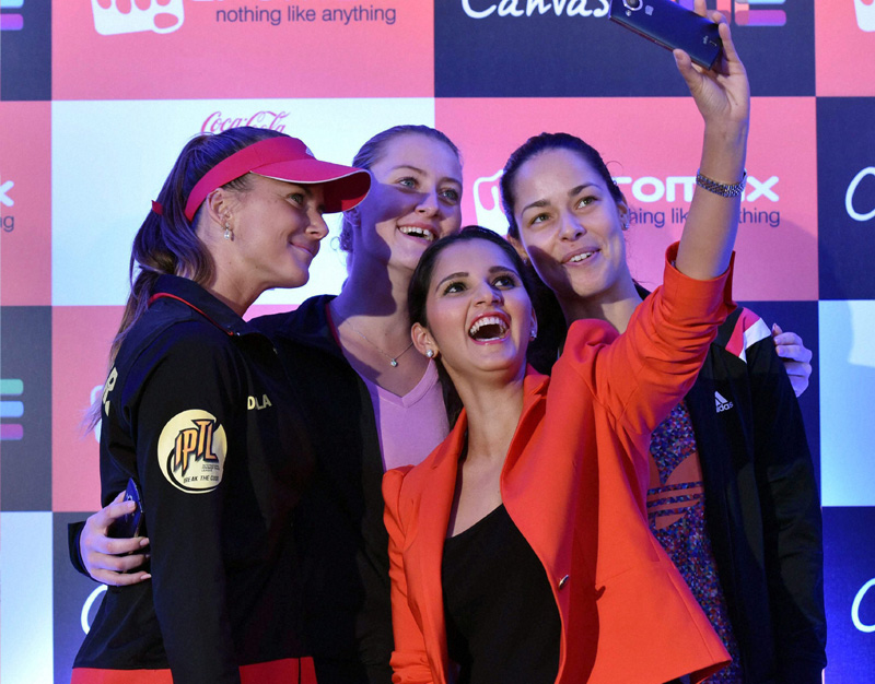 Tennis Champions Daniela Hantuchová, Ana Ivanovic, Sania Mirza and Kristina Mladenovic take selfies with the newly launched Micromax Canvas Hue in New Delhi on Monday. (PTI)