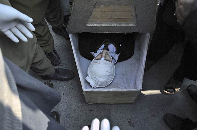 The lifeless body of a Pakistani student, a victim of a Taliban attack in a school, lies in a casket at a local hospital in Peshawar, Pakistan. (AP)