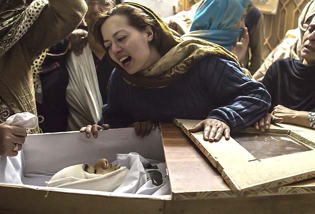A mother mourns her son Mohammed Ali Khan, 15, a student who was killed during an attack by Taliban gunmen on the Army Public School, at her house in Peshawar. (Reuters)