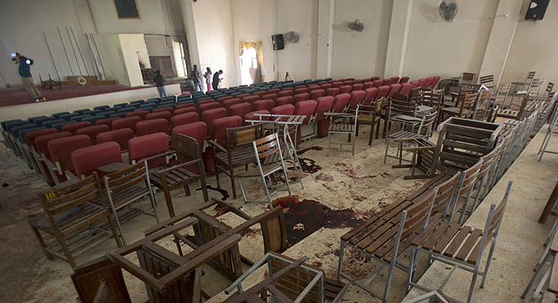 Journalists inside an auditorium of school attacked by Taliban, in Peshawar, Pakistan. (AP)