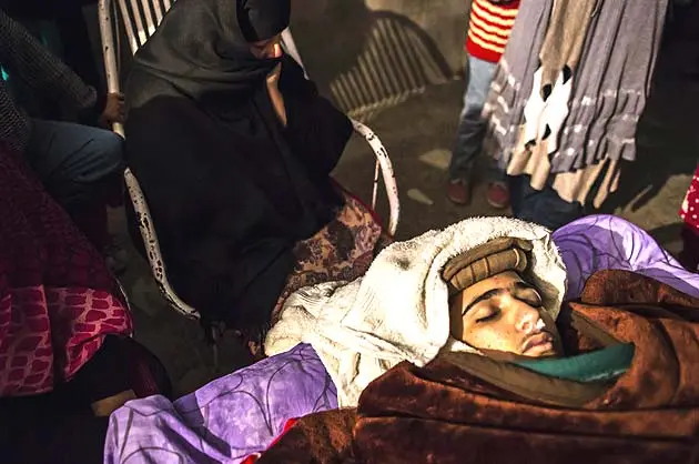 A mother mourns her son Osama Taher, 15, a student who was killed during an attack by Taliban gunmen on the Army Public School, at her house in Peshawar December 16, 2014. At least 132 students and nine staff members were killed on Tuesday after Taliban gunmen broke into a school in the Pakistani city of Peshawar and opened fire, witnesses said, in the bloodiest massacre the country has seen for years. (Reuters)