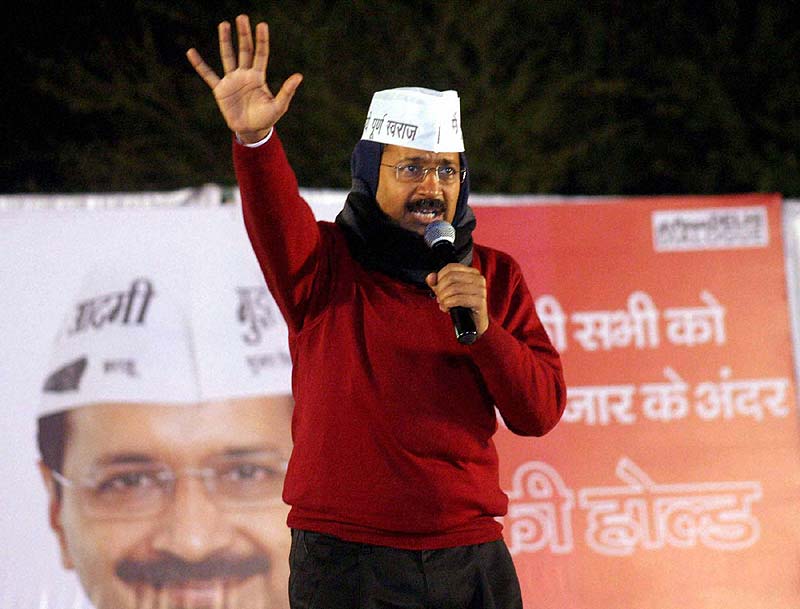 Accusing Bharatiya Janata Party (BJP) of razing slums, Aam Aadmi Party (AAP) promised pucca houses for slum dwellers and freehold rights to the lease holders at affordable rates, as it presented its agenda for 15 lakh residents of 45 resettlement colonies in the national capital.<br>(In pic) AAP chief Arvind Kejriwal addresses a rally at Trilok Puri in East Delhi. (Image: PTI)