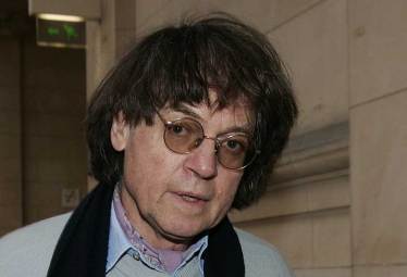 French cartoonist Cabu arrives at a Paris court in this February 8, 2007 file photo. Cartoonist Cabu was one of the journalists killed when hooded gunmen stormed the Paris offices of the weekly satirical magazine Charlie Hebdo renowned for lampooning radical Islam, killing at least 12 people, including two police officers in the worst militant attack on French soil in recent decades January 7, 2015. Picture taken February 8, 2007. REUTERS
