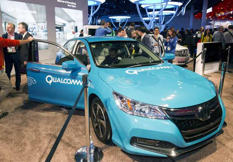 An electric car is shown at the Qualcomm booth during the 2015 International Consumer Electronics Show (CES) in Las Vegas, Nevada. Qualcomm was demonstrating technologies such as wireless charging and vehicle-to-vehicle communication. (Reuters)