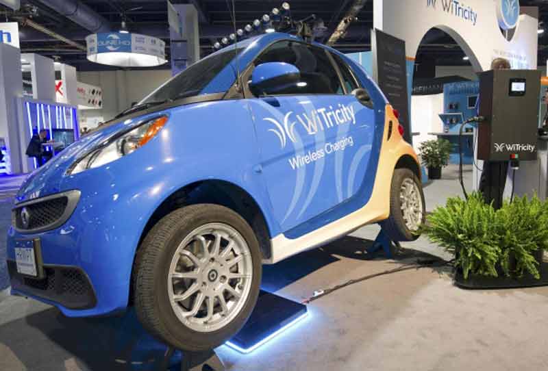 A WiTricity wireless car charger is shown under an electric car during the 2015 International Consumer Electronics Show (CES) in Las Vegas, Nevada. (Reuters)