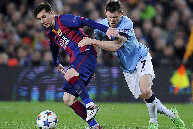 Manchester City's James Milner, right, challenges Barcelona's Lionel Messi, left, during a Champions League round of 16 second leg, soccer match between FC Barcelona and Manchester City at Camp Nou stadium, in Barcelona, Spain, Wednesday, March 18, 2015. AP