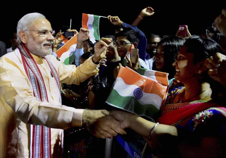 Prime Minister Narendra Modi meets people of Indian community upon his arrival at Mahe in Seychelles on late Tuesday night. PTI