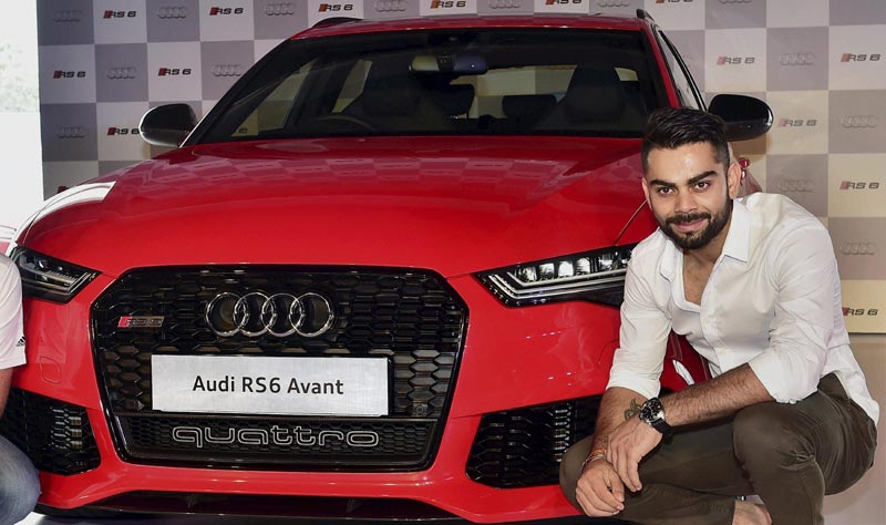 Audi RS6 Avant: Virat Kohli today launched Audi's super sports car Audi RS6 Avant priced at Rs 1.35 crore (ex-showroom Delhi) as it looks to consolidate leadership position in performance segment. (PTI) </br><br><strong>Read more:</strong> <a href="https://www.financialexpress.com/article/industry/automobiles/audi-launches-sports-car-rs6-avant-priced-at-rs-1-35-cr/80224/"><strong>Virat Kohli launches Audi RS6 Avant priced at Rs 1.35 cr</strong></a>