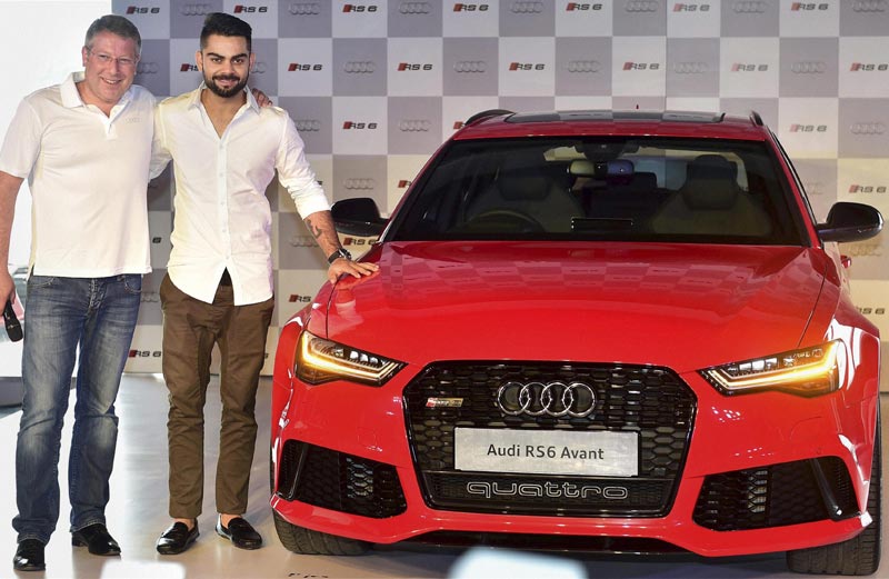 Audi RS6 Avant: Audi RS6 Avant is the fourth sports car to be launched in India by the company this year after the Audi R8 LMX, the new Audi TT Coupe and the new Audi RS 7 Sportback. (PTI) </br><br><strong>Read more:</strong> <a href="https://www.financialexpress.com/article/industry/automobiles/audi-launches-sports-car-rs6-avant-priced-at-rs-1-35-cr/80224/"><strong>Virat Kohli launches Audi RS6 Avant priced at Rs 1.35 cr</strong></a>