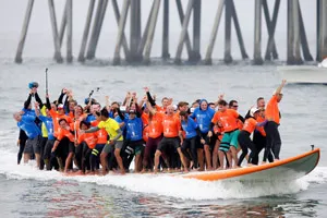 Surf City USA breaks Guinness World Records for ‘Most People Riding a Surfboard at Once’