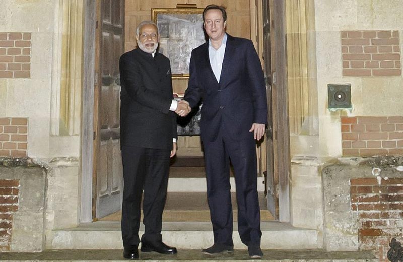 6. Yes Bank and London Stock Exchange (LSE) signed a bond and equity issuance deal in green infrastructure finance and have future plans to issue a green bond to the tune of 300 million pounds. (In photo: Britain's PM David Cameron (R) welcomes Narendra Modi to Chequers, his official country residence, near Aylesbury, England) (Reuters)