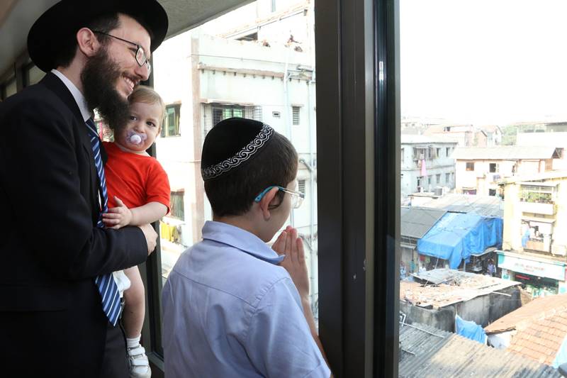 During Moshe's visit to Nariman House, there was a large gathering of members of the Jewish community, police, security personnel and media around the building, whose entry was restricted. (PTI Photo)