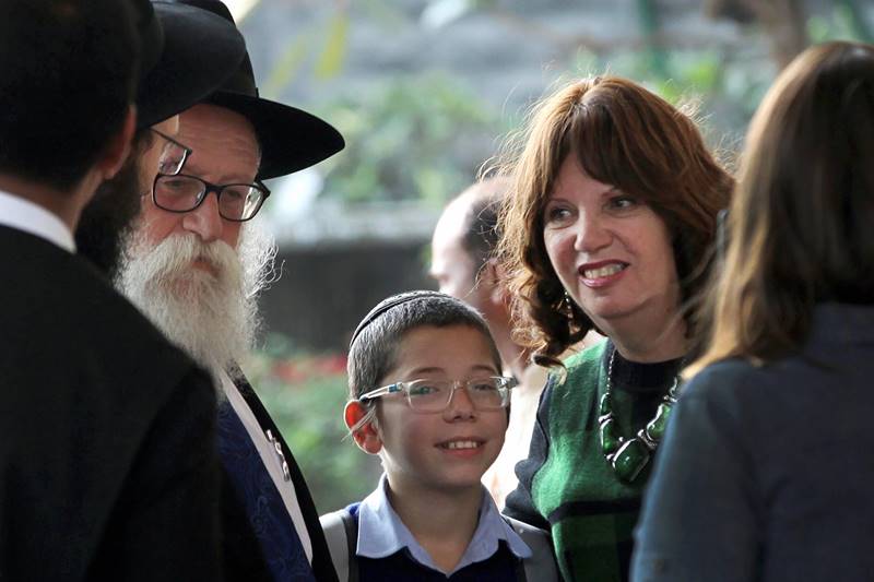 Returning to the place where he was orphaned nine years ago in a terror attack, 11-year-old Moshe Holtzberg today appeared bewildered with the media frenzy as cameras popped to catch his glimpse. Moshe, who was a toddler when Pakistan-based terrorists killed his parents at Nariman House, appeared visibly moved as he spent almost two hours going around the five-storeyed building in south Mumbai. The Israeli resident had kosher food at Nariman House. His grandparents and two uncles, who accompanied him from Israel, were with him during his Nariman House visit. Let us take a look at some of the photos: