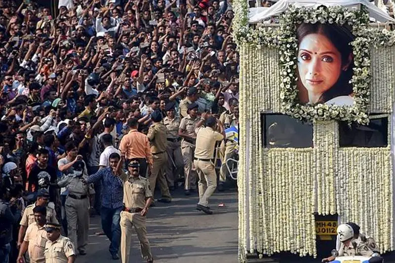 Bollywood icon Sridevi has been cremated with state honours. The diva was on Wednesday cremated with full state honours at the Vile Parle crematorium. Her husband Boney Kapoor performed the last rites. The couple's daughters, Jahnvi and Khushi, were by his side. Sridevi's body was brought to the crematorium in an open, flower-bedecked hearse. Her untimely death at the age of 54 in Dubai on Saturday had shocked the entire film industry and fans. A sea of humanity emerged on the roads to pay last respects to Sridevi. Several bigwigs of Bollywood and other walks of life also paid their last respects to 'Chandni'. Police officials had a tough time manging the crowds. Sridevi was cremated with full state honours. Her body was flown back to Mumbai last night. Here are some of the pictures from her last journey:- (Photo from PTI)