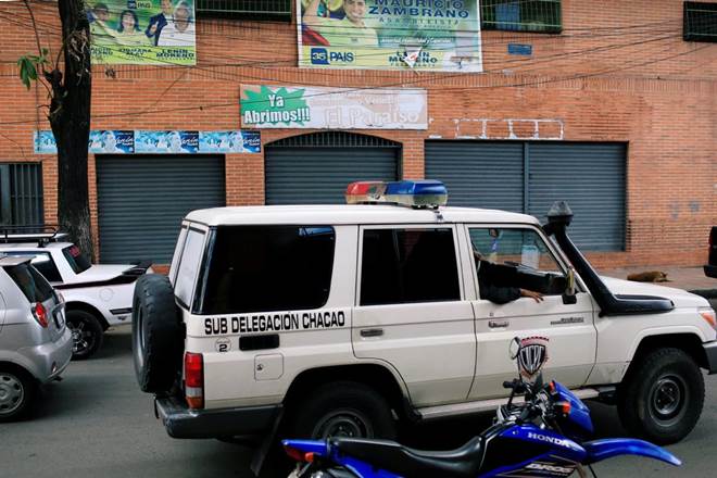 Police van outside the nightclub in Caracas, Venezuela, where at least 17 people died on Saturday. (Image: Reuters)