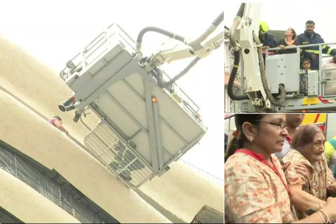 People trapped inside being rescued using cranes. (Image: ANI)