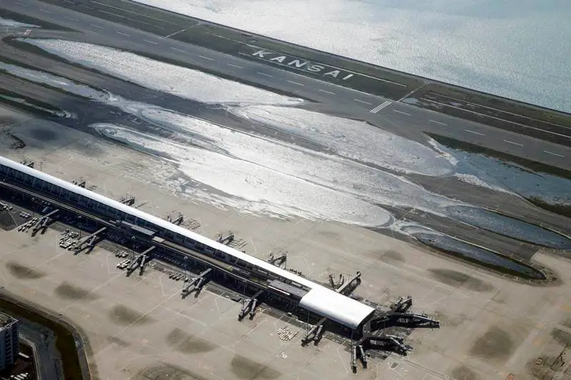 kansai airport japan, kansai airport, kansai international airport, kansai airport sinking, kansai airport japan photos, kansai international airport pictures, kansai airport images, japan typhoon, typhoon jebi