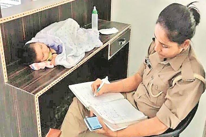 Archana Jayant with her infant baby at work 