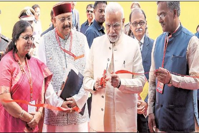 PM Narendra Modi inaugurates an exhibition at the first Uttarakhand investors’ summit on Sunday as governor Baby Rani Maurya and CM Trivendra Singh Rawat (right) look on. (PTI)