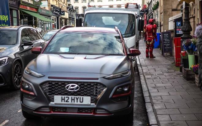 But the superhero wasn’t in the UK because the world fell in a drastic peril. The idea was more to show off a new car. The Marvel comic superhero drove out of a Hyundai dealership in a Kona Iron Man Special Edition. And then later bamboozled onlookers as he took a dog for walk, went for a KFC drive-thru and dropped off a load of cardboard at a local recycling plant.