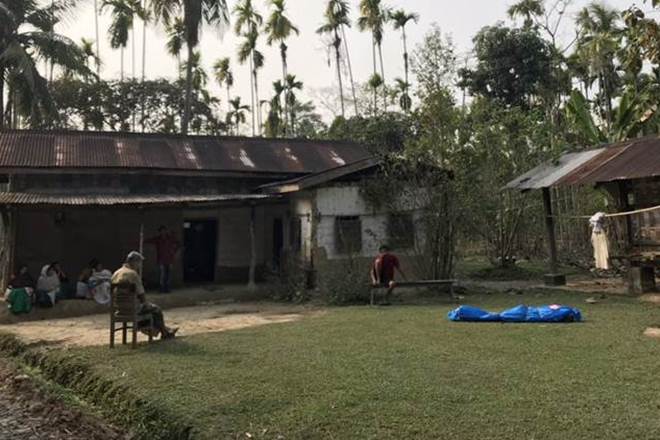 Relatives and neighbours at the house of Jagat Phukan in Jagibari village of Golaghat — one of the victims whose body lies packed in blue.