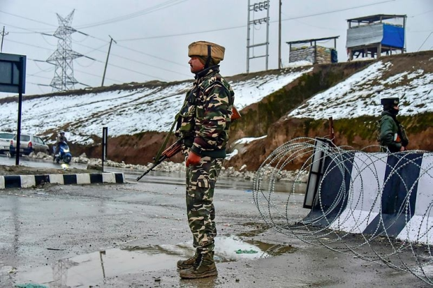 An army soldier stands guard near the site of the suicide bomb attack (PTI Photo/S Irfan)