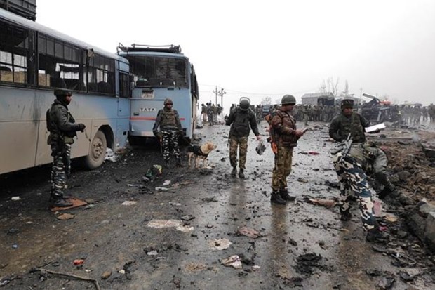 Soldiers examining the debris. (Reuters/Younis Khaliq)
