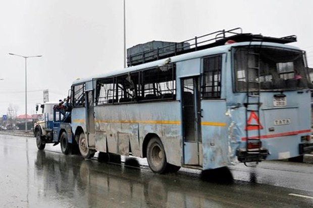 Another picture of the damaged vehicle being taken away from the site in Pulwama district. (PTI Photo)