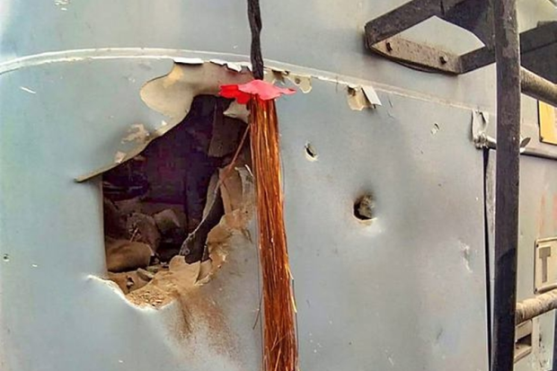 A damaged section of a CRPF vehicle that was attacked by the militants in Pulwama district (PTI Photo)