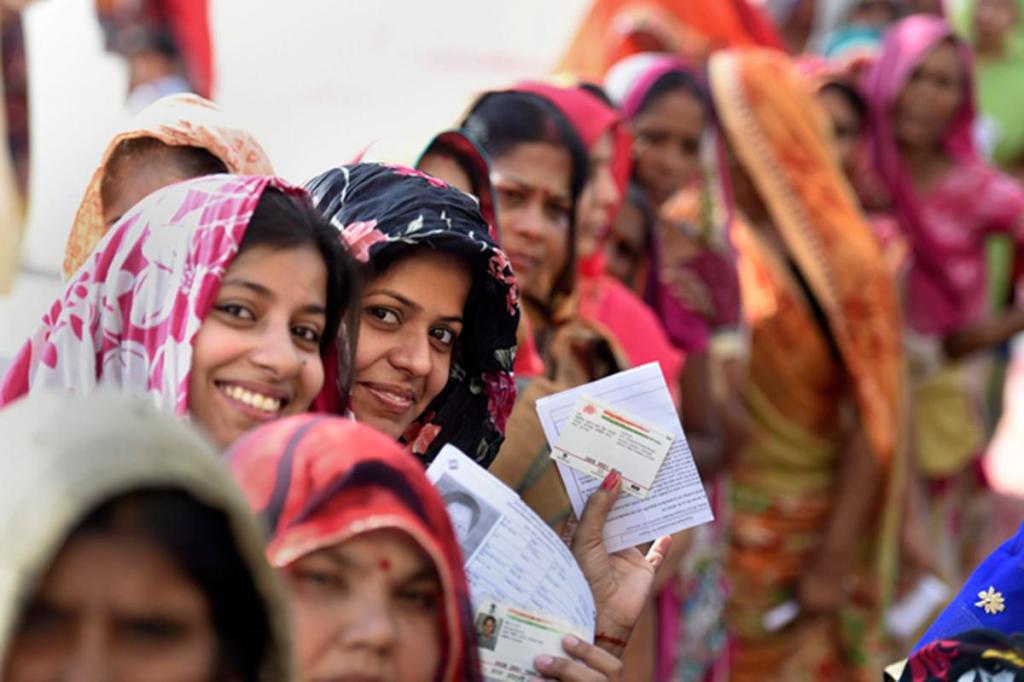 New Delhi: Voters wait in queues as they display their voting identity cards at Sangam Vihar polling station during the sixth phase of Lok Sabha polls, in New Delhi, Sunday, May 12, 2019. (PTI Photo/Vijay Verma) (PTI5_12_2019_000228B) *** Local Caption ***