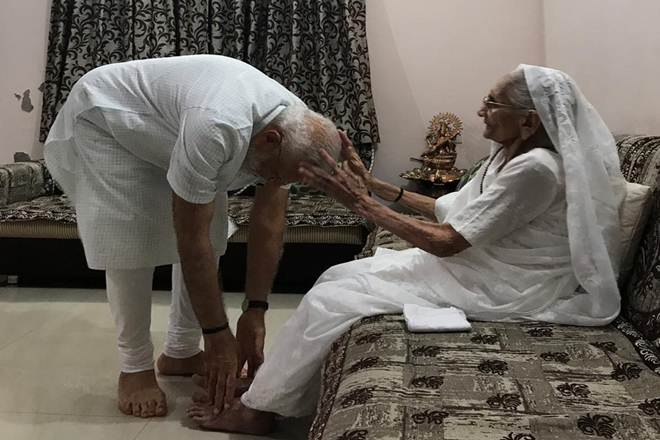 Prime Minister Narendra Modi with his mother Heeraben Modi at her residence in Gandhinagar. (ANI Photo)