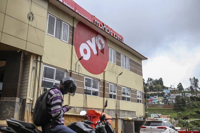 The logo of OYO Rooms, operated by Oravel Stays Pvt, is displayed outside a hotel in Ooty, Tamil Nadu, India, on Friday, June 8, 2018. Most Asian markets were in the red on June 18 as concern that the row between U.S. and China may turn into a full-blown trade war. Most Asian markets were in the red on June 18 as concern that the row between U.S. and China may turn into a full-blown trade war. Photographer: Dhiraj Singh/Bloomberg