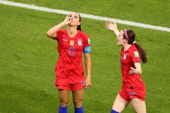 Alex Morgan of the US celebrates scoring their second goal against England with teammate Rose Lavelle. (Reuters)