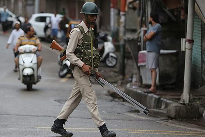 A paramilitary soldier walks on a street in Jammu (AP Photo)