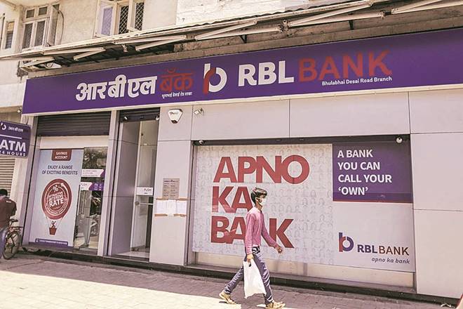 A pedestrian wearing a protective mask walks past an RBL Bank Ltd. branch on a near-empty street in Mumbai, India, on Monday, May 4, 2020. India's central bank Governor Shaktikanta Das and the chief executive officers of the nation's banks have discussed ways to ensure credit flow to businesses once the world's toughest stay-at-home order ends. Photographer: Dhiraj Singh/Bloomberg