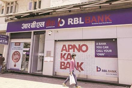 A pedestrian wearing a protective mask walks past an RBL Bank Ltd. branch on a near-empty street in Mumbai, India, on Monday, May 4, 2020. India's central bank Governor Shaktikanta Das and the chief executive officers of the nation's banks have discussed ways to ensure credit flow to businesses once the world's toughest stay-at-home order ends. Photographer: Dhiraj Singh/Bloomberg