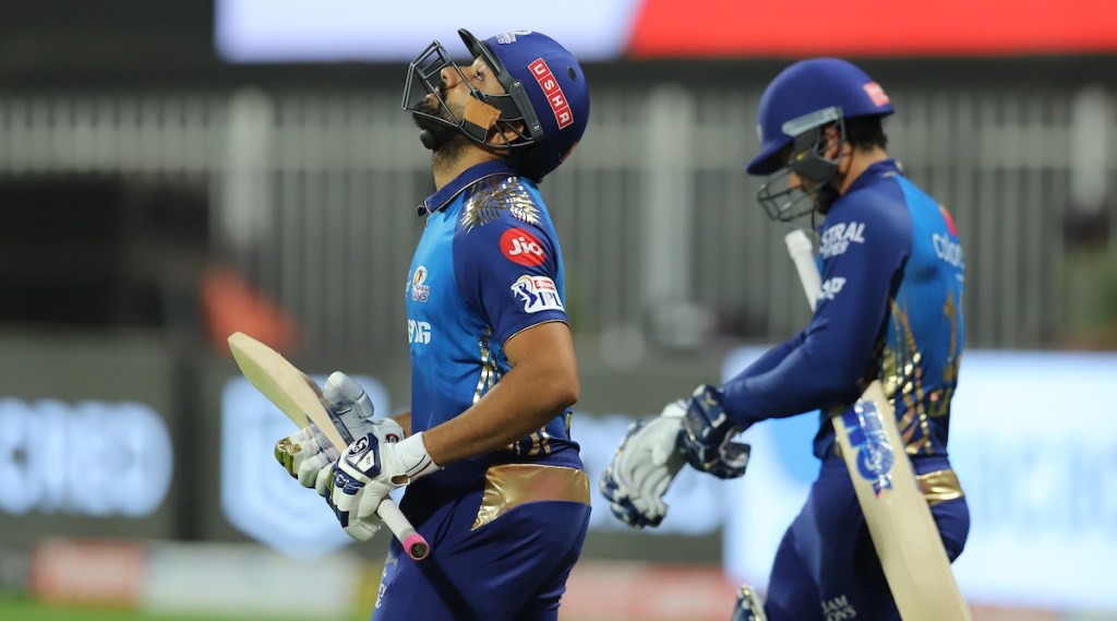 Mumbai Indians batsman Rohit Sharma raises his bat after scoring half-century during the Indian Premier League 2020 cricket match against Kings XI Punjab, at Sheikh Zayed Stadium, Abu Dhabi. (PTI Photo/Sportzpics for BCCI)