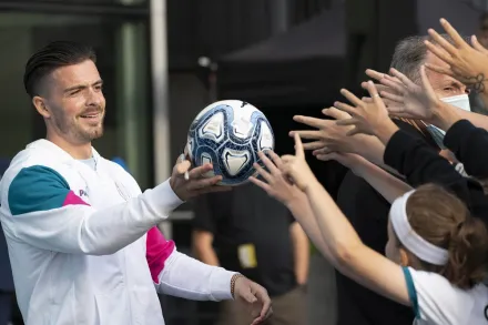 Manchester City's new signing Jack Grealish hands a football to supporters (PTI IMage)