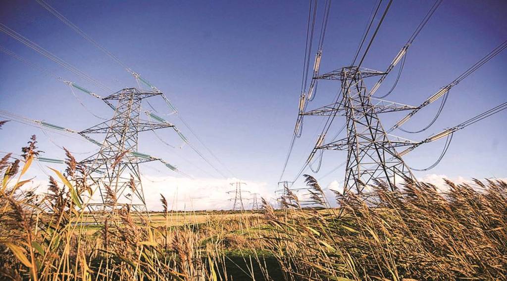 Electricity transmission pylons near Dungeness Power station, operated by Electricite de France SA (EDF), in Dungeness, U.K., on Monday, Oct. 26, 2020. The U.K.'s power supply buffer is set to shrink this winter compared to last year due to outages at power plants and the unexpected closure of two of Calon Energy Ltd.'s gas-fired stations after the company went into administration. Photographer: Chris Ratcliffe/Bloomberg