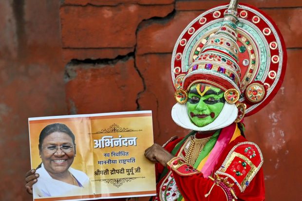 An artist celebrates election of NDA's presidential candidate Droupadi Murmu in New Delhi. (PTI Photo)