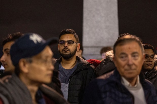 People stand after the door to pay respect to Britain's Queen Elizabeth was closed, following her death, outside of the Houses of Parliament in London, Britain. REUTERS