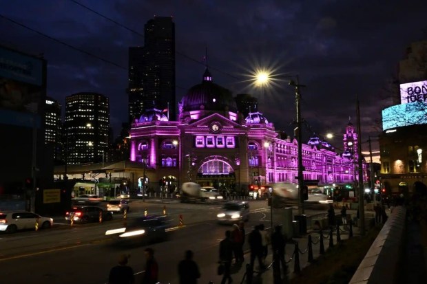 Melbourne’s Flinders Street station in Victoria, Australia, is lit up in regal purple.REUTERS