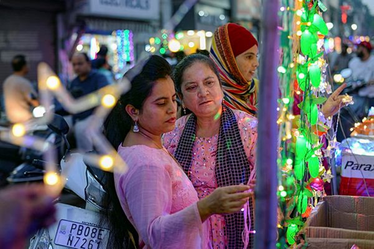 Customers shop for decorative lights ahead of Diwali festival, in Jalandhar. (PTI Photo)