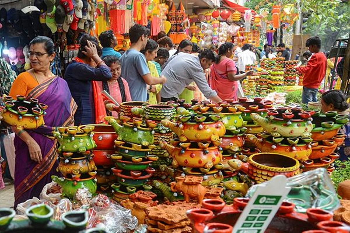 People buy designer earthen lamps and decoration items ahead of Diwali festival in Bengaluru. (PTI Photo/Shailendra Bhojak)