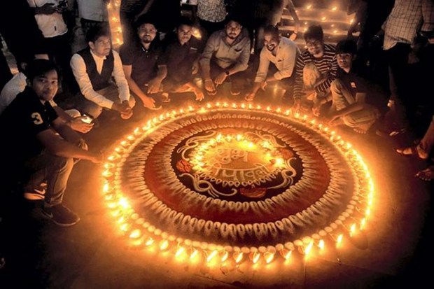Students celebrate Diwali by lighting earthern lamps inside the Banaras Hindu University, in Varanasi. (PTI photo)