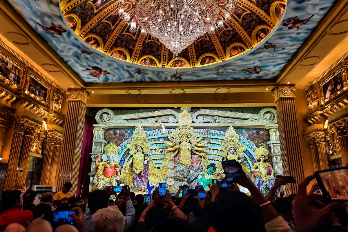 Kolkata: Devotees at the Durga Puja pandal at Sreebhumi Sporting Club during the Durga Puja festival celebrations. (PTI Photo)