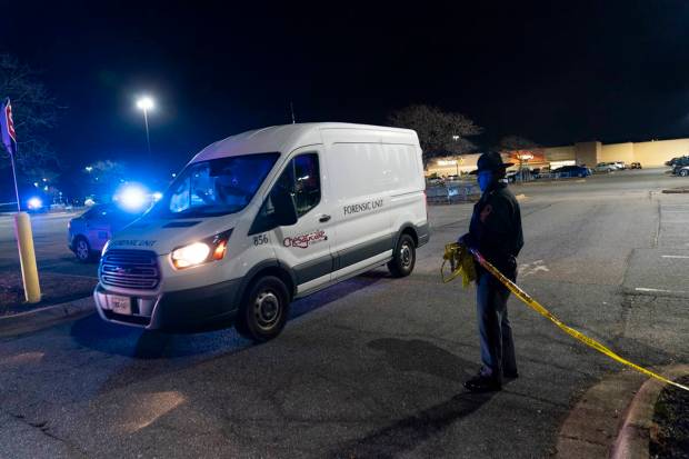A forensics van leaves as law enforcement work at the scene of a mass shooting at a Walmart. (AP Photo)