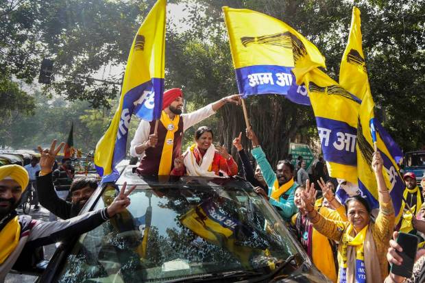 AAP candidate from the Inder Puri ward Jyoti Gautam celebrates her win with supporters outside a counting centre for the MCD elections at Patel Nagar, in New Delhi. (PTI Photo)