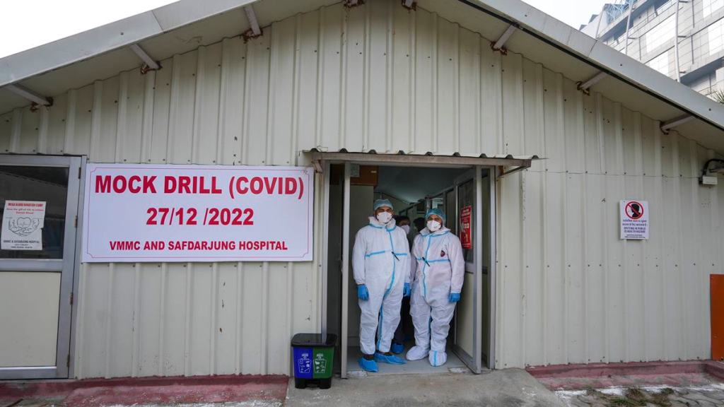 Health workers during a mock drill for COVID-19 preparedness, at Safdarjung hospital in New Delhi, Tuesday, Dec. 27, 2022. (PTI Photo)
